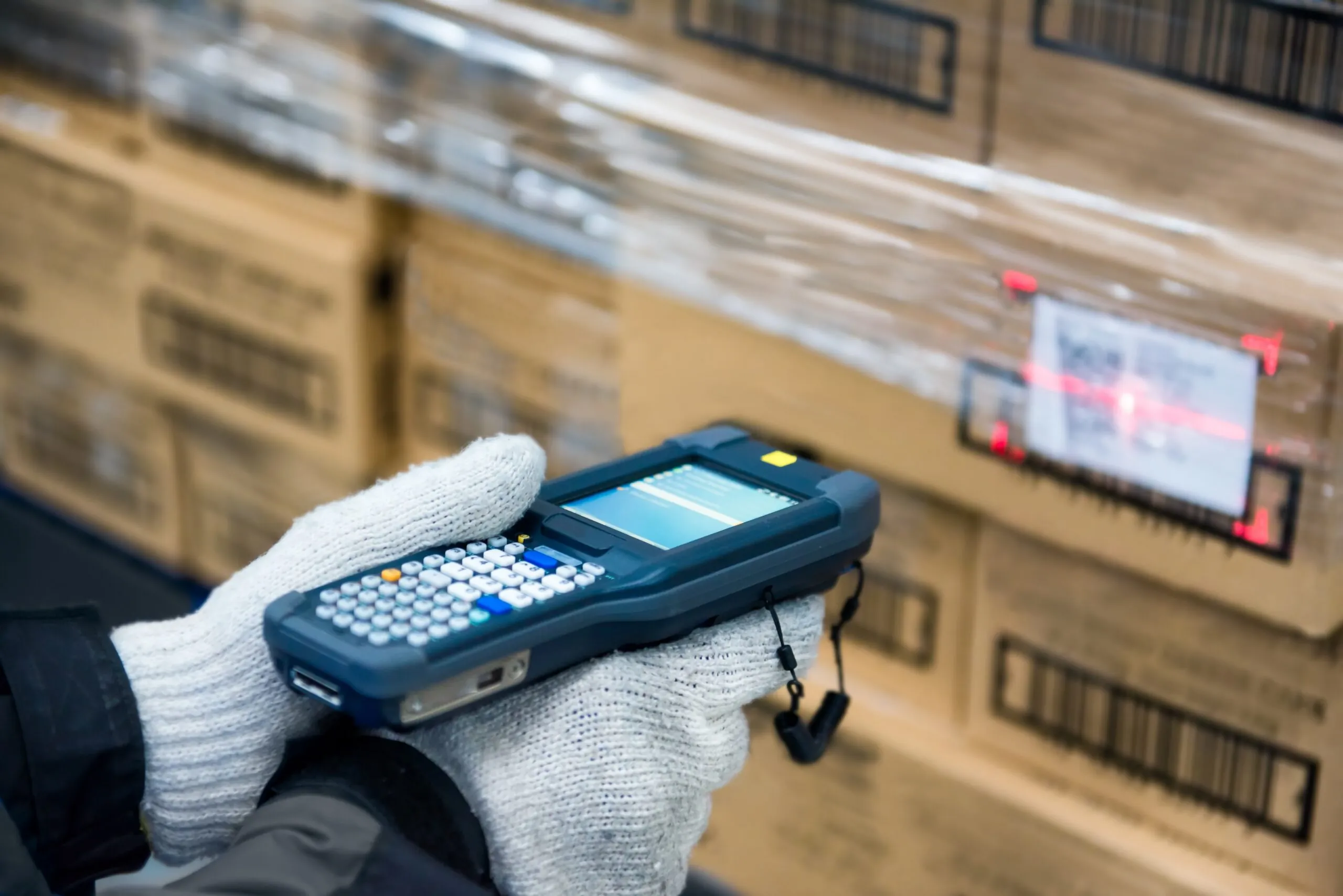warehouse worker scanning a barcode on a box