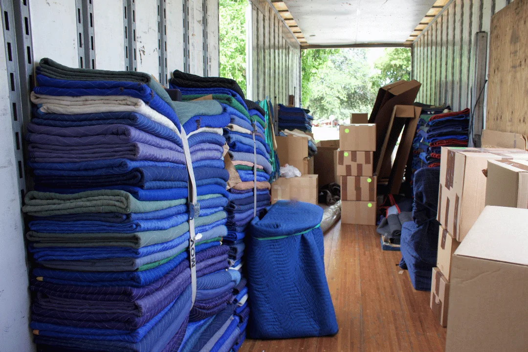 Blanket Wrap bundled stacks of moving blankets in a moving trailer