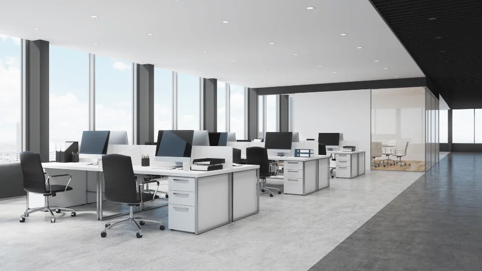 modern white office space with desks and computers
