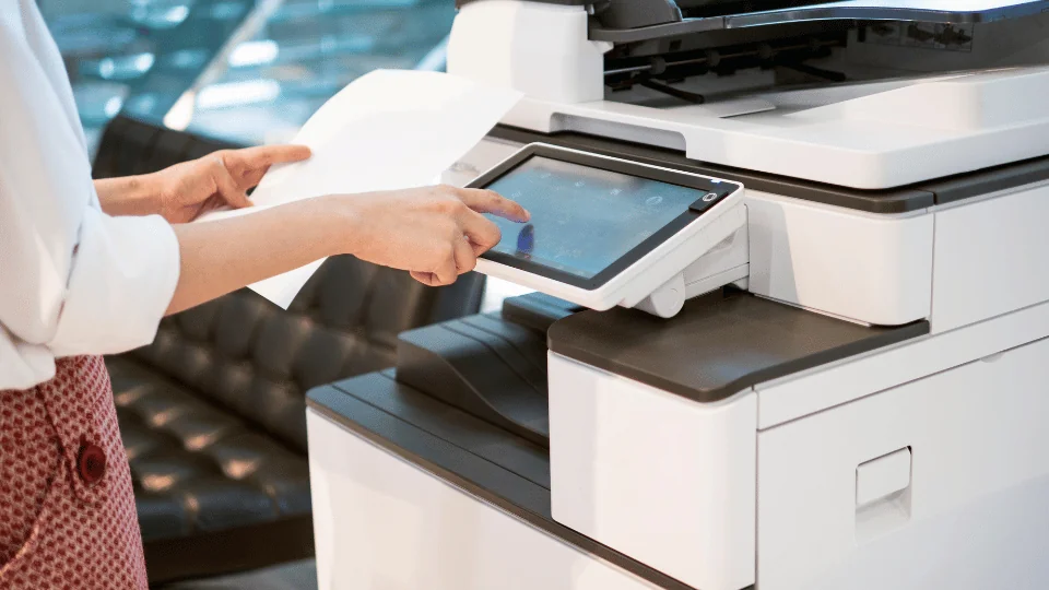 Shipping Office Supplies and Equipment office woman using company printer