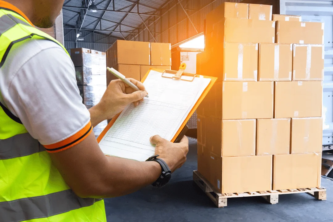 What you can do to avoid missed pickups Freight Worker Double Checking Shipments On His Clipboard