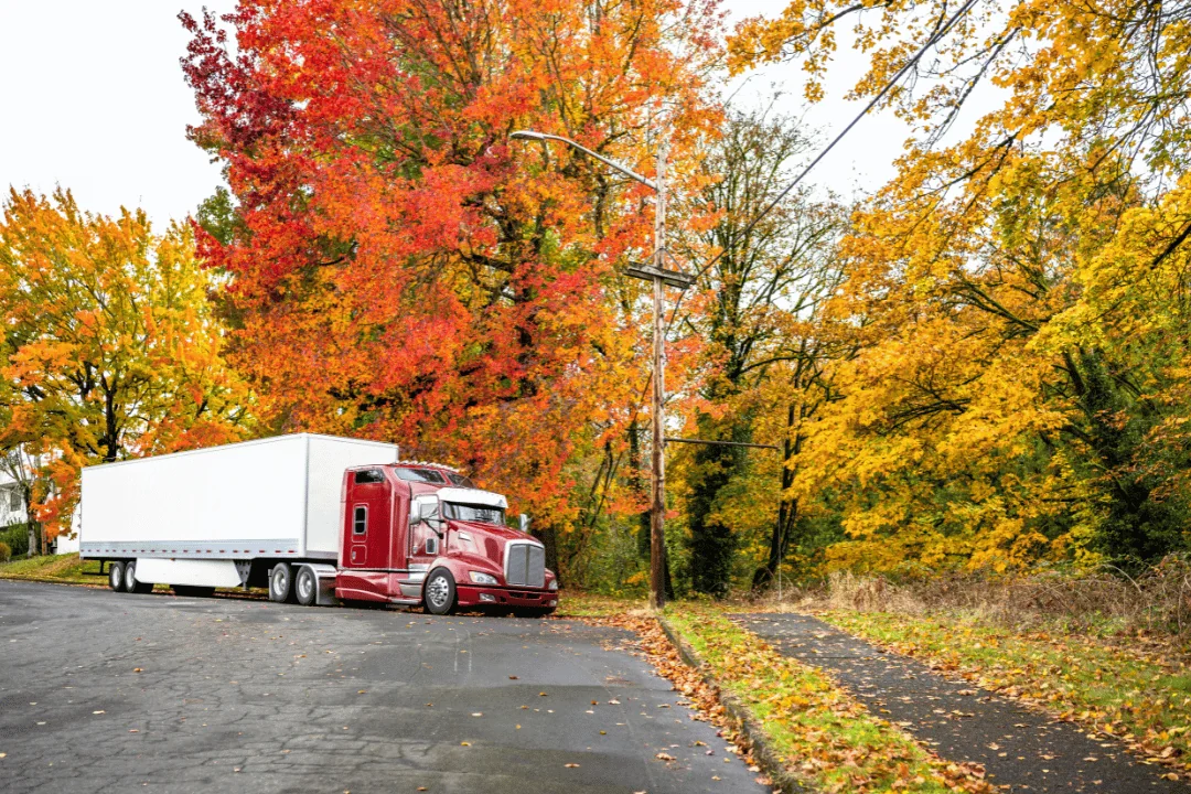 What you can do to avoid missed pickups Red Semi Trailer Truck Parked On Side Of Residential Road In The Fall