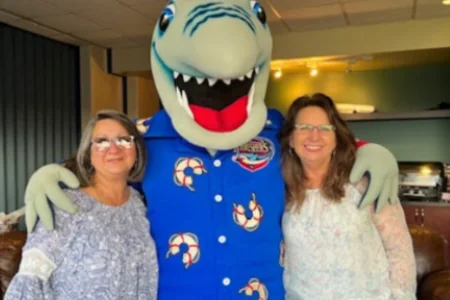 Two FreightCenter employees with threshers shark